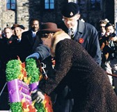 Cpl. Michael Simpson's mother, Mrs. Loyola Park, the National Silver Cross Mother, laying a wreath on behalf of the Mothers of Canada during the National Remembrance Ceremony on Parliament Hill in 1999.